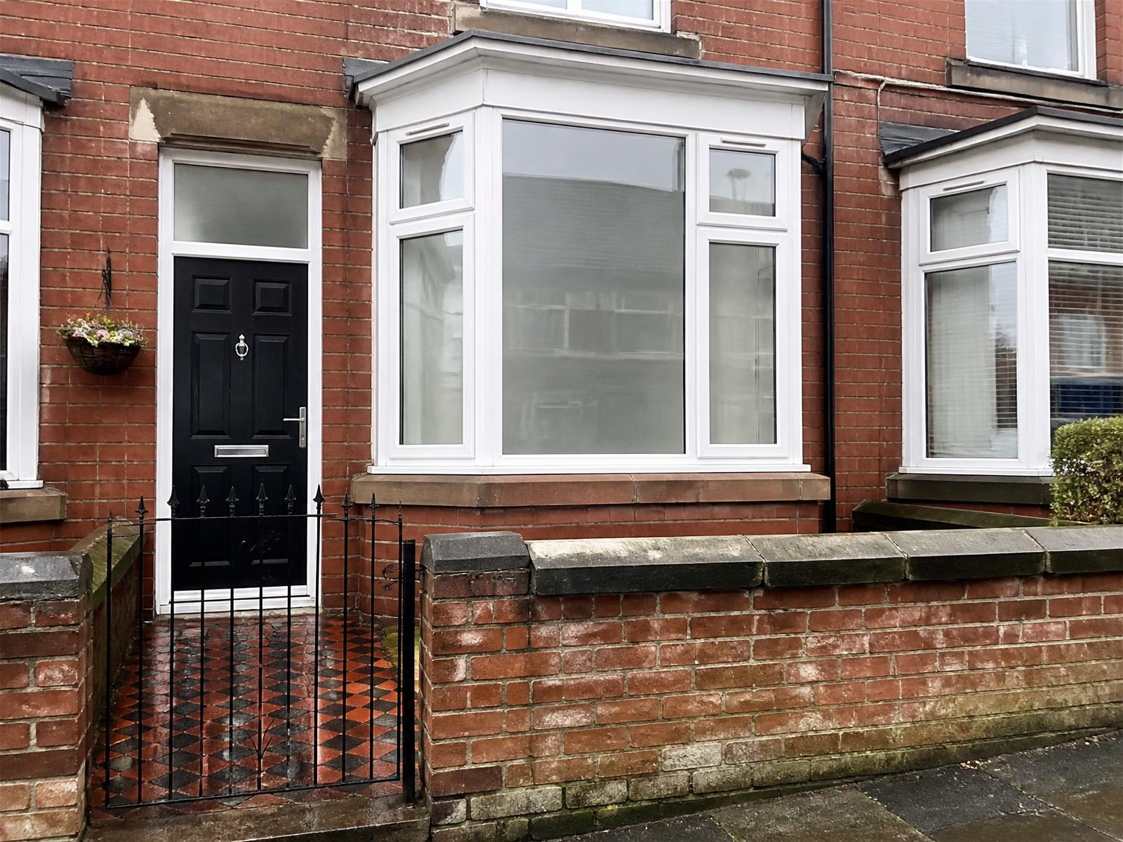 Replacement bay window fitted to a red brick Victorian terrace